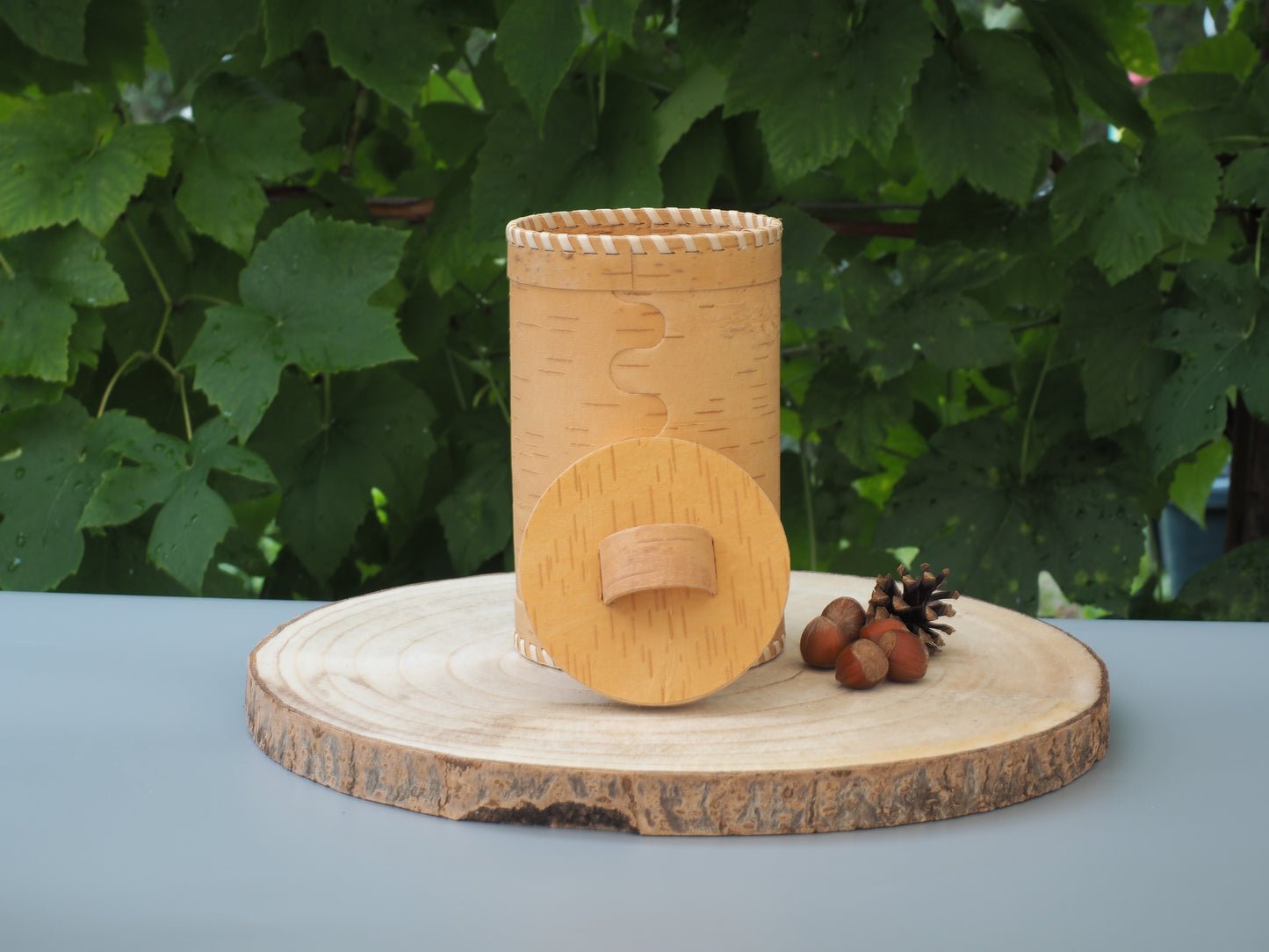 Storage boxes made of birch bark and birch wood, base and lid braided with light birch bark