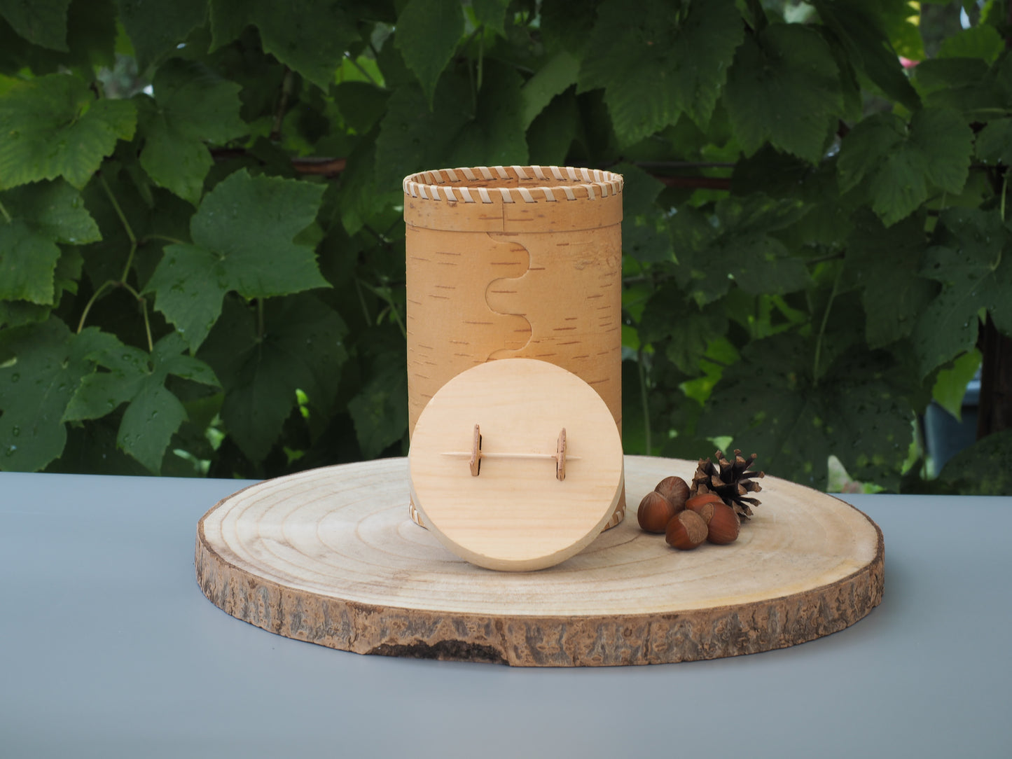Storage boxes made of birch bark and birch wood, base and lid braided with light birch bark