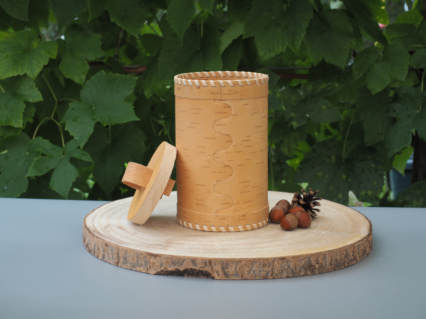 Storage boxes made of birch bark and birch wood, base and lid braided with light birch bark