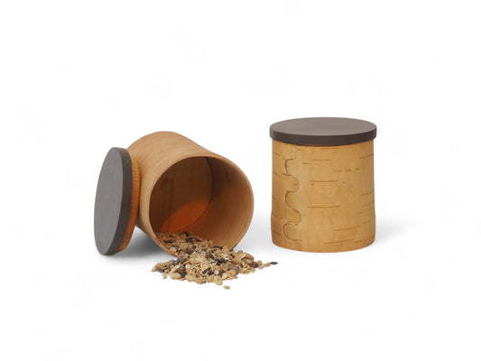 Storage jars made of birch bark and birch wood lids in coffee bean colour